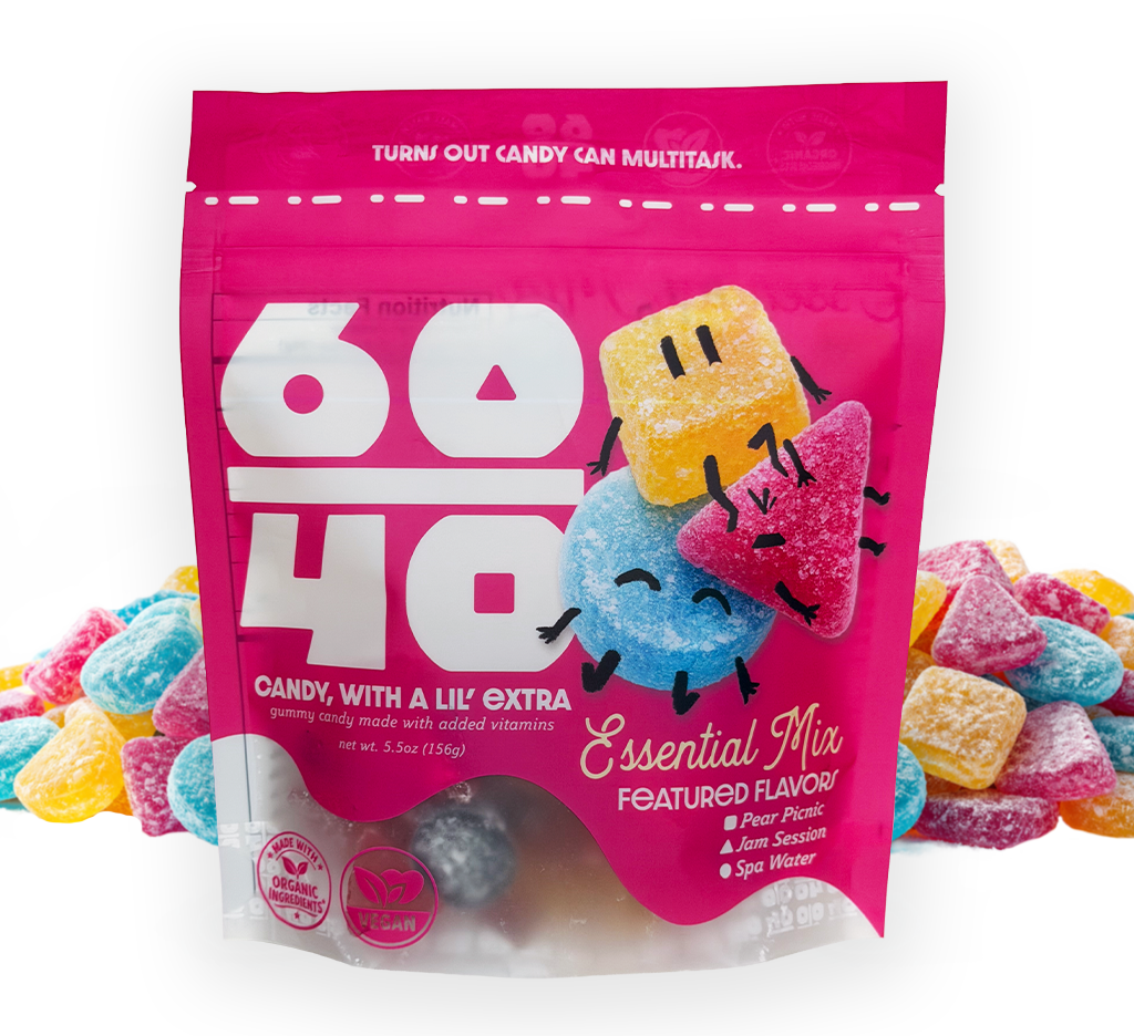 Pink bag of Essential Mix gummy candies with cartoon characters on a white background