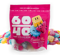 Pink bag of Essential Mix gummy candies with cartoon characters on a white background